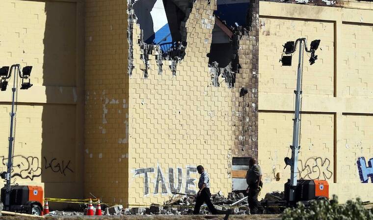 JAMM AQUINO / JAQUINO@STARADVERTISER.COM
                                The damaged cargo building is seen after a Kamaka Air plane crashed into the structure near Daniel K. Inouye International Airport in Honolulu Tuesday afternoon, killing two young pilots.