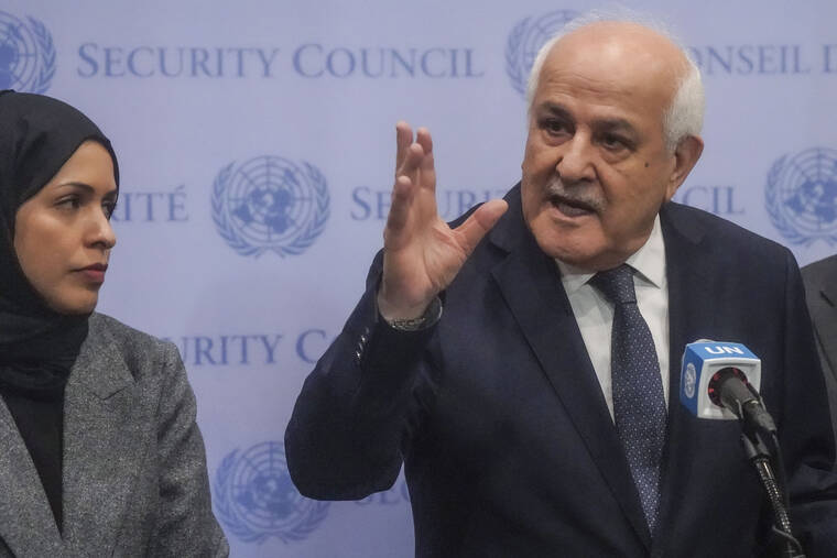 ASSOCIATED PRESS
                                Palestinian United Nations Ambassador Riyad Mansour, right, speaks during a press conference ahead of a U.N. General Assembly vote on a resolution calling for a cease fire between Israel and Hamas in Gaza today at U.N. headquarters.