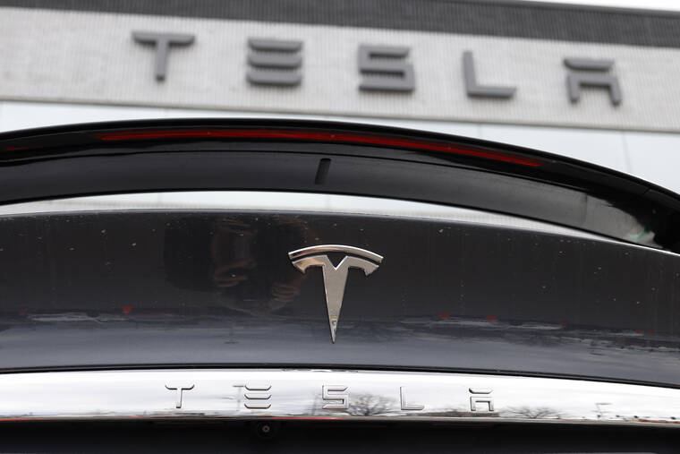 ASSOCIATED PRESS
                                The Tesla company logo shines off the rear deck of an unsold 2020 Model X at a Tesla dealership, in April 2020, in Littleton, Colo. Tesla is recalling more than 2 million vehicles across its model lineup to fix a defective system that’s supposed to ensure drivers are paying attention when they use Autopilot. Documents posted by U.S. safety regulators say the company will send out a software update to fix the problems.