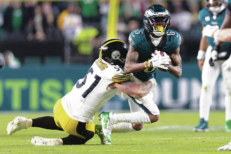 BILL STREICHER / IMAGN IMAGES 
                                Philadelphia Eagles wide receiver DeVonta Smith was brought down by Pittsburgh Steelers linebacker Nick Herbig, a Saint Louis alum, during the third quarter at Lincoln Financial Field in Philadelphia on Sunday.