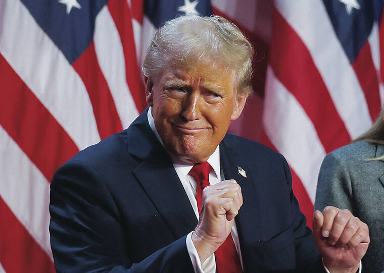 REUTERS
                                Republican presidential nominee and former U.S. President Donald Trump dances after speaking following early results from the presidential election in Palm Beach County Convention Center, in West Palm Beach, Fla., on Wednesday.