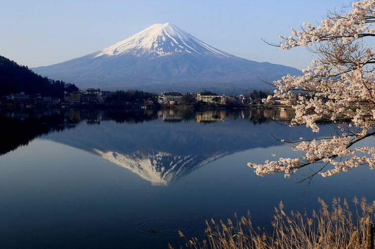 REUTERS
                                Mount Fuji, a UNESCO World Heritage site, is visible from Lake Kawaguchiko, in Fujikawaguchiko, Japan.