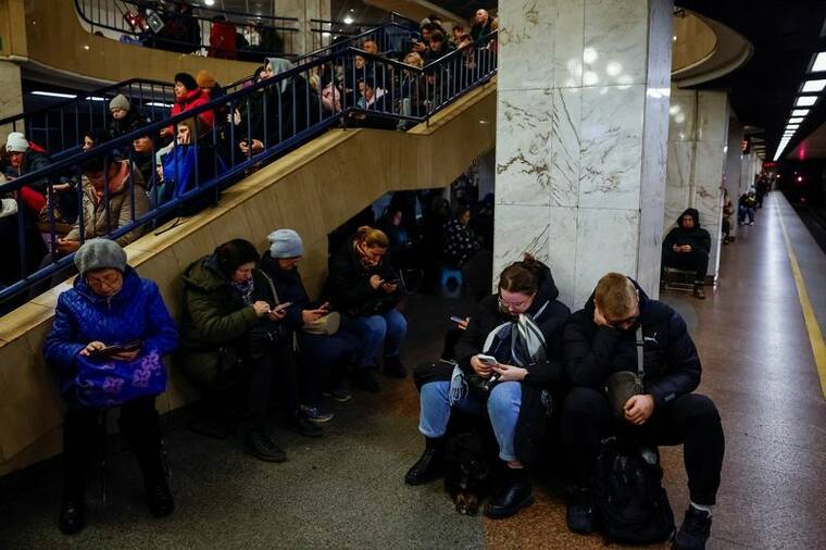 REUTERS/ALINA SMUTKO
                                People take shelter inside a metro station during a Russian military attack, amid Russia’s attacks on Ukraine, in Kyiv, Ukraine.