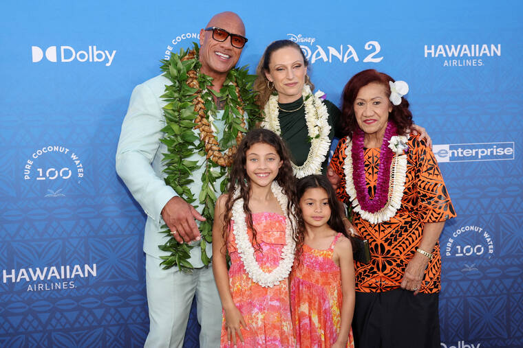 REUTERS/MARCO GARCIA / NOV. 21
                                Actor Dwyane Johnson, Jasmine Johnson, Lauren Hashian, Tiana Johnson, and Ata Johnson arrive at the premiere of Disney Animation’s film Moana 2 in Kapolei.