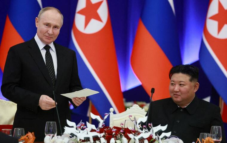 SPUTNIK/VLADIMIR SMIRNOV/POOL VIA REUTERS
                                Russia’s President Vladimir Putin and North Korea’s leader Kim Jong Un attend a state reception in Pyongyang, North Korea, on June 19. Ukraine’s military intelligence service said today that the first North Korean units trained in Russia had been deployed in the Kursk region, a Russian border area where Ukrainian forces staged a major incursion in August.