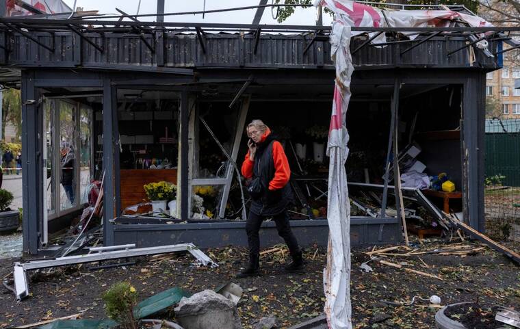 REUTERS/THOMAS PETER
                                A woman inspects the damage to a shop after a Russian drone strike, amid Russia’s attack on Ukraine, in Kyiv, Ukraine, on Tuesday.