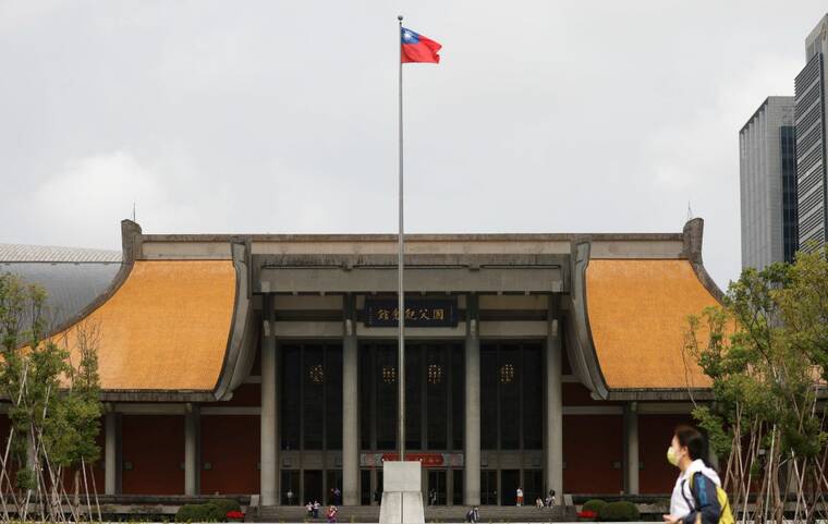 REUTERS/CARLOS GARCIA RAWLINS/FILE PHOTO
                                People walk near a fluttering Taiwanese flag outside the Sun Yat-Sen Memorial Hall in Taipei, Taiwan, in November 2023. China’s defense ministry on Friday broke its silence about days of military activities around Taiwan, saying it was entitled to stage exercises and the military would “not be absent” if required to fight separatist forces.