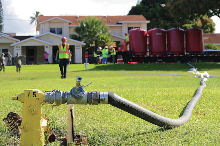 JAMM AQUINO / 2021
                                In November 2021, jet fuel from the Red Hill fuel storage facility tainted an Oahu waterline that serves 93,000 people, causing symptoms ranging from digestive problems to rashes. Above, the Navy started flushing waterlines at the Pearl City Peninsula military housing neighborhood in December 2021.