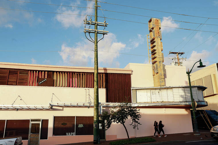 JAMM AQUINO / JAQUINO@STARADVERTISER.COM
                                The Queen Theater building is seen Thursday from the vantage point of Waialae Avenue going west, above. At top, the building on Waialae Avenue and at left, in its heyday, August 1951.