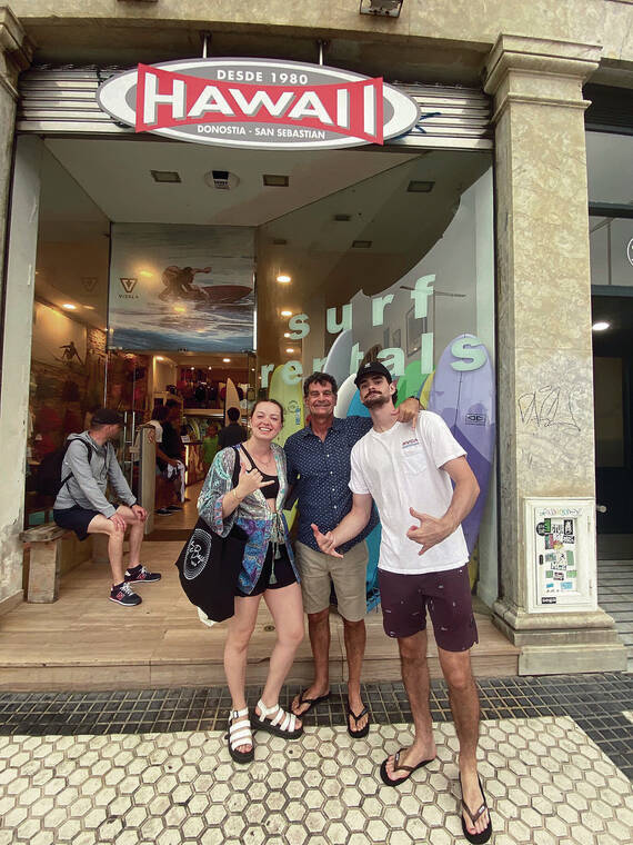 From left, Phoebe Fox, Mark Fox and Charlie Fox of Honolulu took a trip to San Sebastian, Spain, where they stopped at the Hawaii surf and rental shop, located across Zurriola Beach. Photo by Colette Fox.