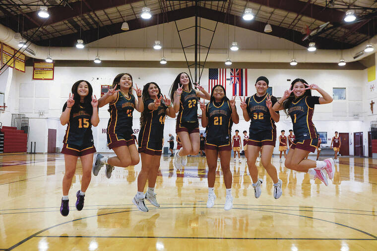 GEORGE F. LEE / GLEE@STARADVERTISER.COM 
                                The Maryknoll Spartan girls basketball team, led by Pua Herrington (23), took to the air to pose for a shot.