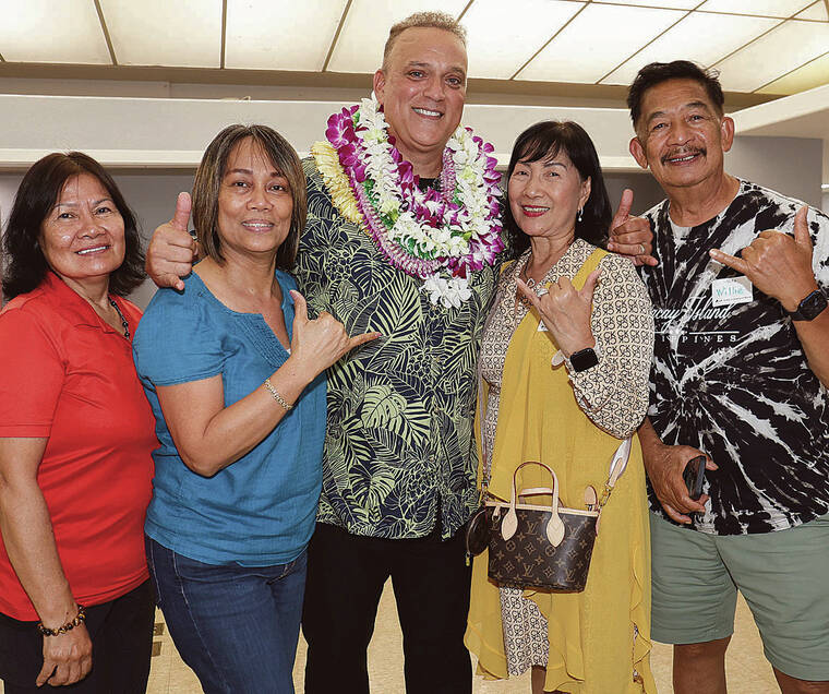 TIM WRIGHT / SPECIAL TO THE TRIBUNE-HERALD
                                Dr. Kimo Alameda, candidate for Hawaii County Mayor, shares a shaka with supporters on Election Night at Nani Mau Gardens.