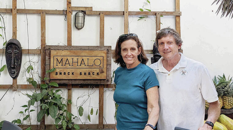 Kelly and Clark Smith of Kailua were taking in the sights in Casco Viejo, Panama, and stopped for refreshment at Mahalo Snack Shack. Kelly Smith said the restaurant in a “shady courtyard offers fresh juices and healthy food in Panama City.” Photo by a restaurant waiter.