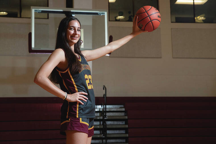 GEORGE F. LEE / GLEE@STARADVERTISER.COM
                                Maryknoll Spartan girl’s basketball player Put Herrington on Monday, Dec. 9, 2024 at Maryknoll School Gymnasium.