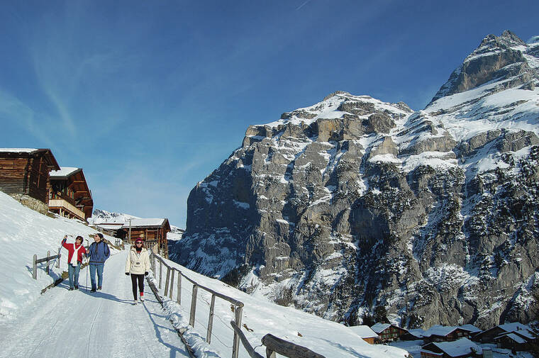 COURTESY CAMERON HEWITT
                                The Swiss village of Gimmelwald, under a blanket of snow, is a picturesque place for winter festivities.